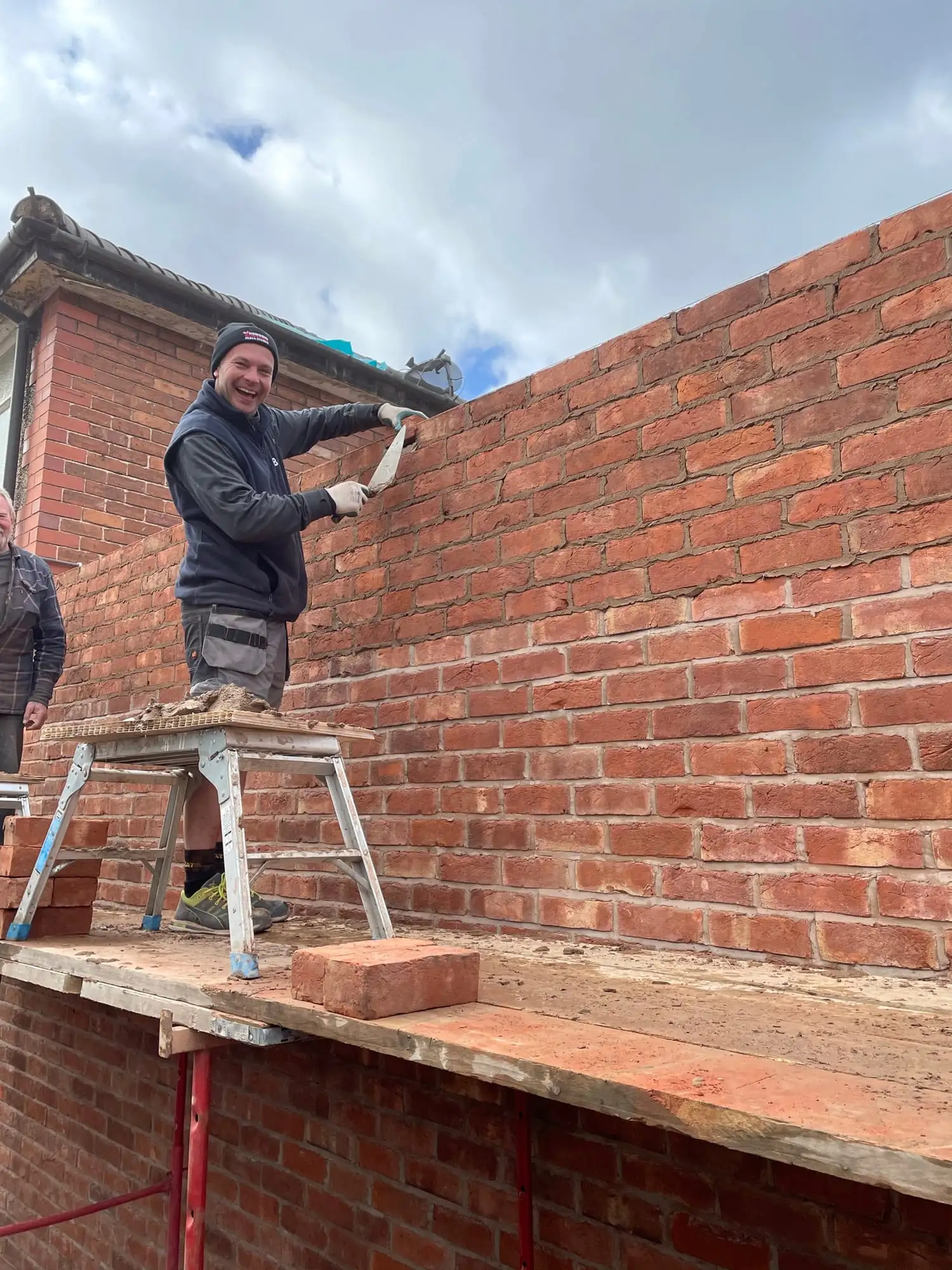 2026 10 A Tom Laying Bricks